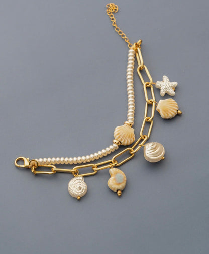 Pulsera 2 en 1 Caracoles + Aretes