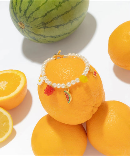 Pulsera Broche Frutas + Aretes